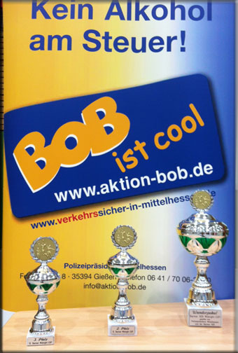 BOB-Plakat mit den Pokalen des Midnight-Cup in Gießen